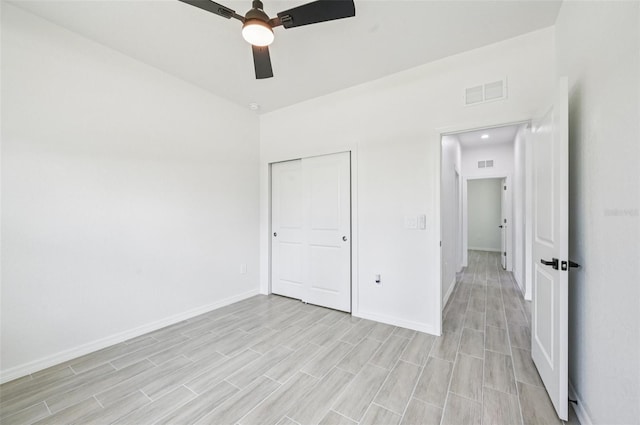 2523 Hagerick Ln, North Port, FL 34288 - unfurnished bedroom featuring light wood-type flooring, ceiling fan, and a closet