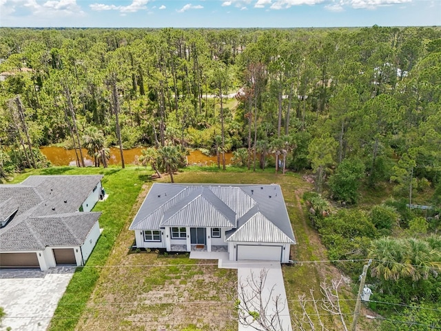 2523 Hagerick Ln, North Port, FL 34288 - view from above of property with a heavily wooded area