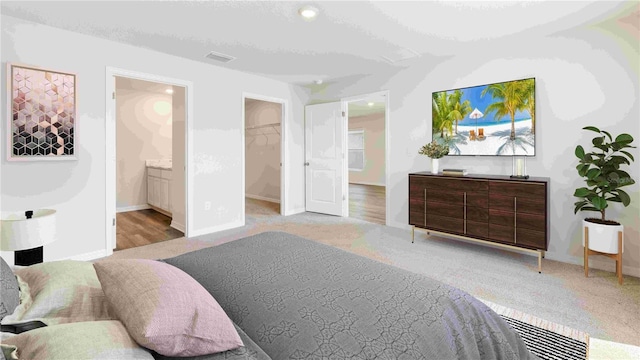 12055 Lansing Gln, Parrish, FL 34219 - bedroom featuring carpet floors, a spacious closet, ensuite bath, and recessed lighting
