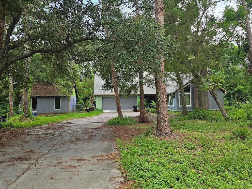 4607 Mink Rd, Sarasota, FL 34235 - view of front facade featuring concrete driveway and a garage