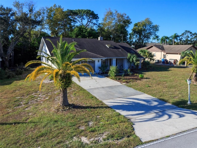 8260 Berkeley Manor Blvd, Spring Hill, FL 34606 - ranch-style house with driveway and a front lawn