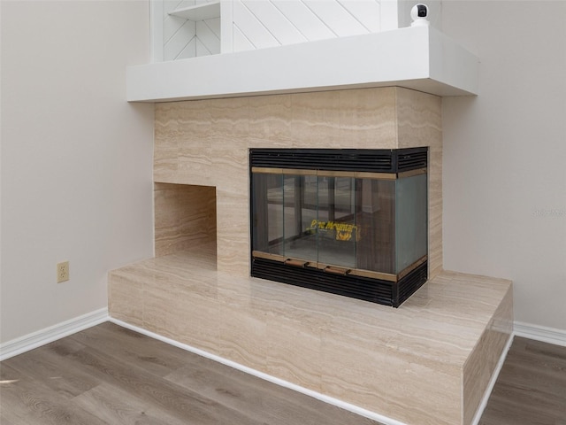 8260 Berkeley Manor Blvd, Spring Hill, FL 34606 - detailed view of a tiled fireplace and wood finished floors