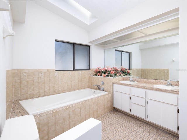 8260 Berkeley Manor Blvd, Spring Hill, FL 34606 - full bath with a garden tub, double vanity, and a skylight