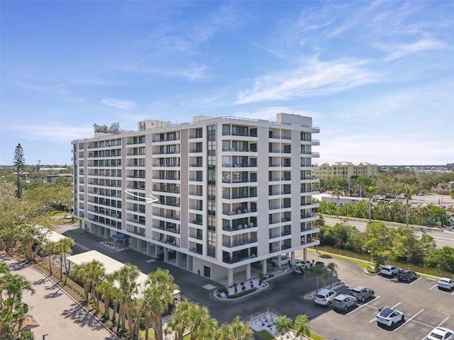 6415 Midnight Pass Rd Unit 502, Sarasota, FL 34242 - view of apartment building / complex featuring uncovered parking