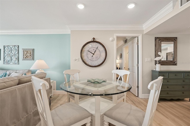 6415 Midnight Pass Rd Unit 502, Sarasota, FL 34242 - dining space with ornamental molding, light wood-style floors, and recessed lighting