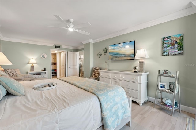 6415 Midnight Pass Rd Unit 502, Sarasota, FL 34242 - bedroom featuring ornamental molding, light wood-style flooring, and a ceiling fan
