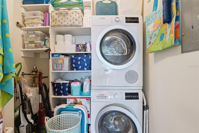 6415 Midnight Pass Rd Unit 502, Sarasota, FL 34242 - laundry area featuring estacked washer and dryer and electric panel