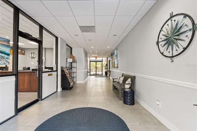 6415 Midnight Pass Rd Unit 502, Sarasota, FL 34242 - corridor featuring light tile patterned flooring and a paneled ceiling