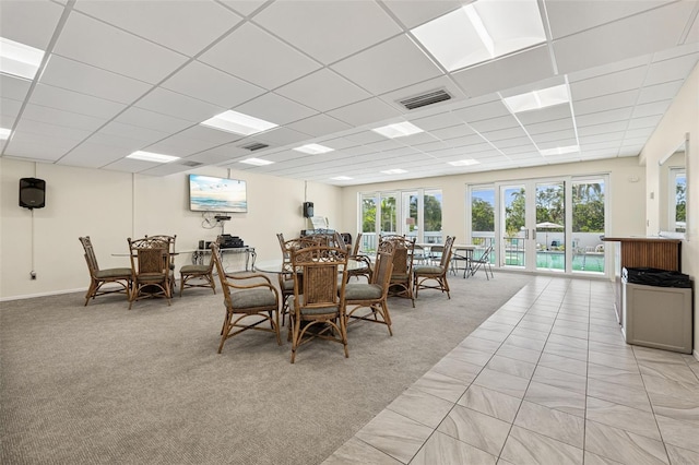 6415 Midnight Pass Rd Unit 502, Sarasota, FL 34242 - dining area featuring french doors, a paneled ceiling, and light colored carpet
