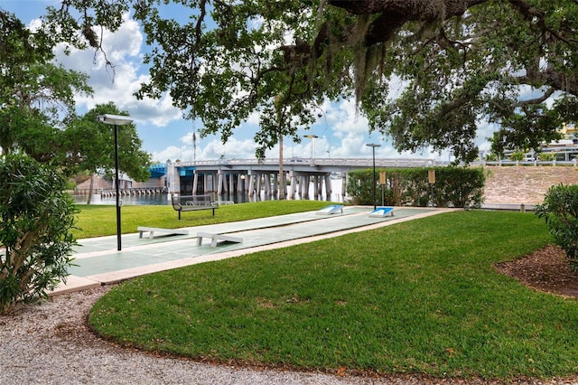 6415 Midnight Pass Rd Unit 502, Sarasota, FL 34242 - surrounding community with a lawn and shuffleboard