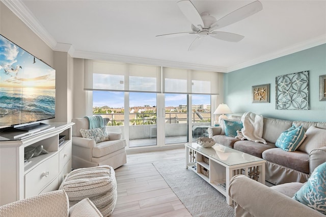 6415 Midnight Pass Rd Unit 502, Sarasota, FL 34242 - living area featuring crown molding, a ceiling fan, plenty of natural light, and light wood finished floors