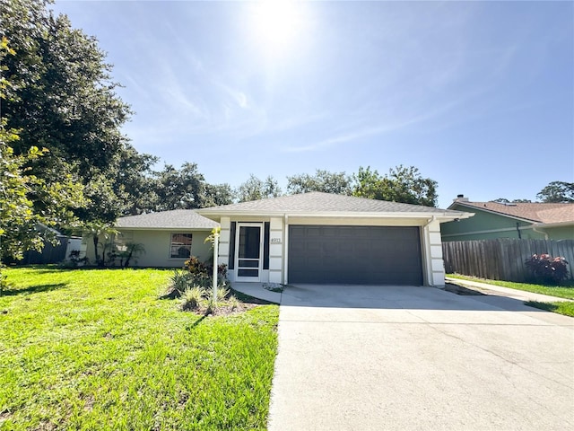 4913 32nd St E, Bradenton, FL 34203 - single story home with concrete driveway, a garage, and stucco siding