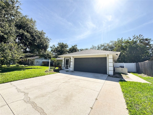 4913 32nd St E, Bradenton, FL 34203 - ranch-style house with concrete driveway and an attached garage