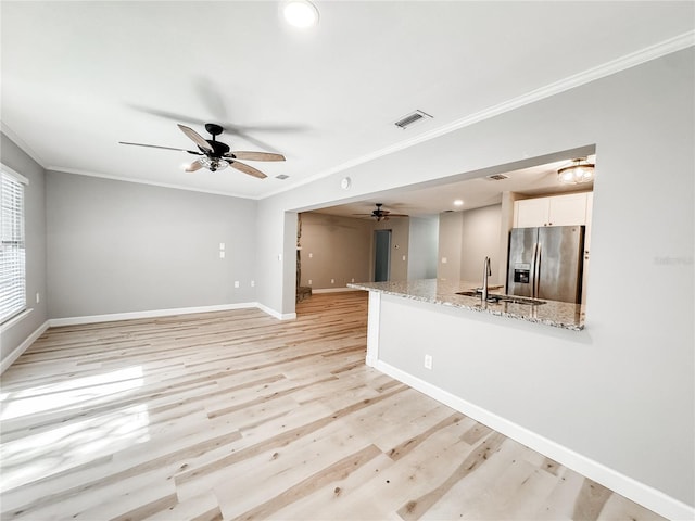 4913 32nd St E, Bradenton, FL 34203 - unfurnished living room featuring crown molding, ceiling fan, light wood-style flooring, and recessed lighting