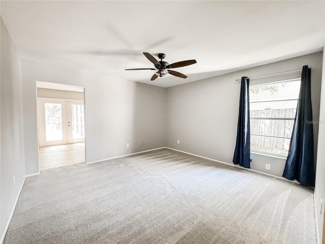 4913 32nd St E, Bradenton, FL 34203 - unfurnished room featuring a ceiling fan, carpet flooring, and french doors