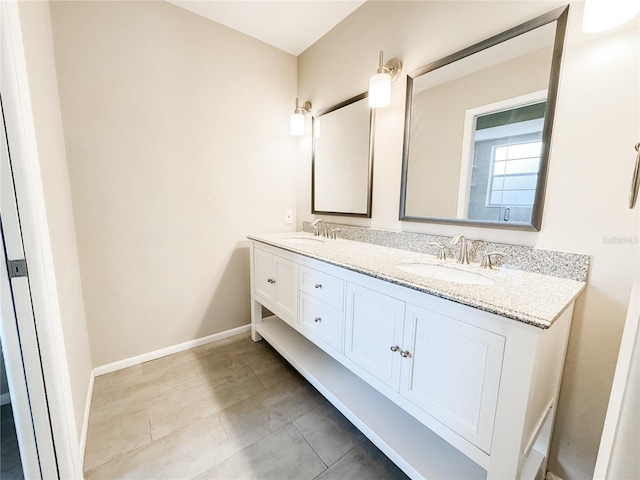 4913 32nd St E, Bradenton, FL 34203 - bathroom featuring double vanity and tile patterned floors
