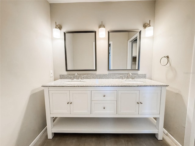 4913 32nd St E, Bradenton, FL 34203 - bathroom with double vanity and baseboards