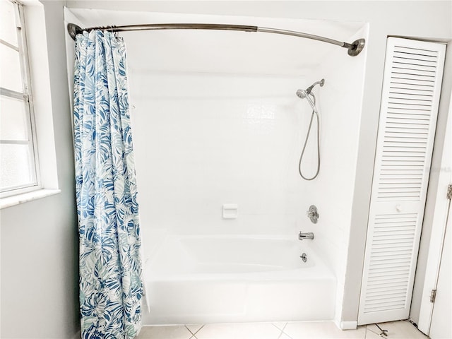 4913 32nd St E, Bradenton, FL 34203 - bathroom with a closet, shower / bath combo, and tile patterned floors