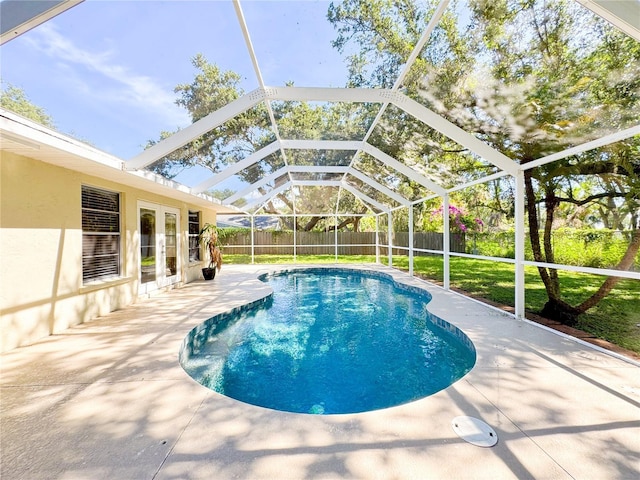 4913 32nd St E, Bradenton, FL 34203 - view of pool featuring french doors, a fenced backyard, a patio, and a lanai