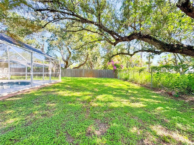 4913 32nd St E, Bradenton, FL 34203 - fenced backyard featuring glass enclosure