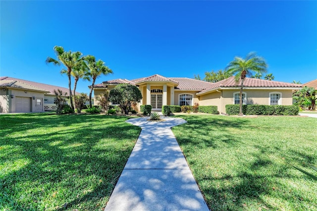 8315 Eagle Xing, Sarasota, FL 34241 - mediterranean / spanish home with stucco siding, a tile roof, and a front lawn