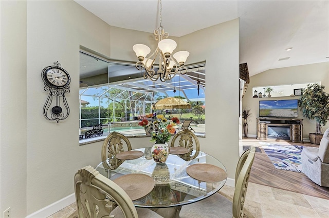 8315 Eagle Xing, Sarasota, FL 34241 - dining space with a chandelier and vaulted ceiling