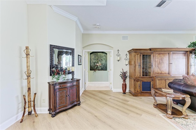 8315 Eagle Xing, Sarasota, FL 34241 - sitting room featuring light wood-style floors and ornamental molding