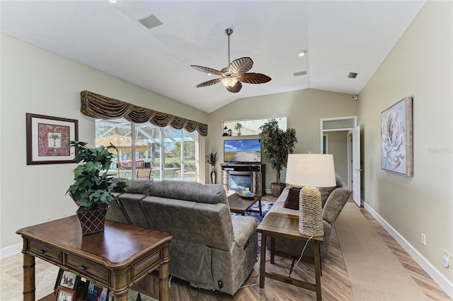 8315 Eagle Xing, Sarasota, FL 34241 - living room with light wood-style floors, a ceiling fan, and vaulted ceiling