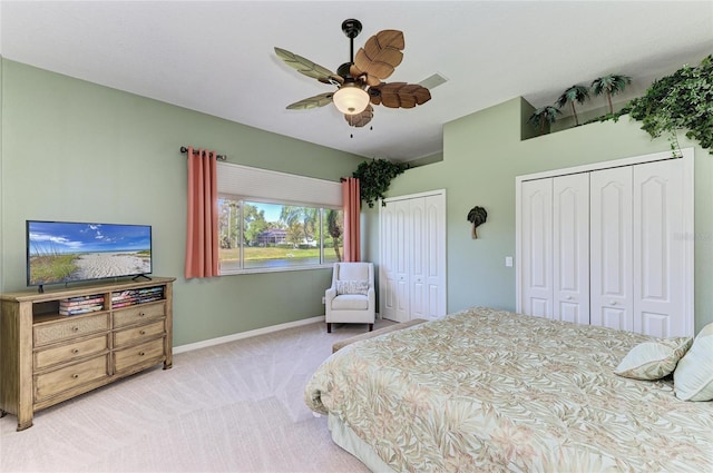 8315 Eagle Xing, Sarasota, FL 34241 - carpeted bedroom with multiple closets, a ceiling fan, and lofted ceiling