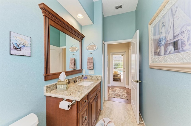 8315 Eagle Xing, Sarasota, FL 34241 - bathroom with vanity and a textured wall