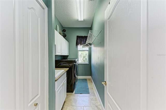 8315 Eagle Xing, Sarasota, FL 34241 - laundry area featuring separate washer and dryer, cabinet space, and a textured ceiling