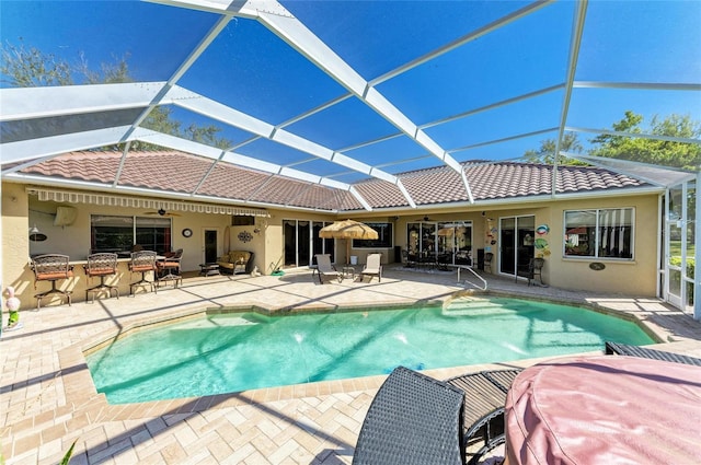 8315 Eagle Xing, Sarasota, FL 34241 - outdoor pool with a patio, ceiling fan, and glass enclosure