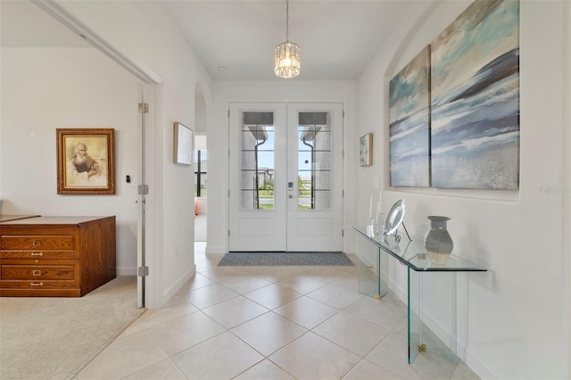 4961 Seafoam Trl, Bradenton, FL 34211 - foyer entrance featuring french doors, light tile patterned floors, and a chandelier