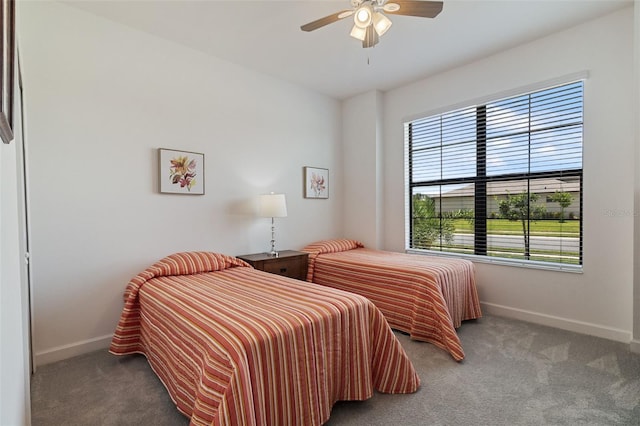 4961 Seafoam Trl, Bradenton, FL 34211 - carpeted bedroom featuring baseboards and a ceiling fan