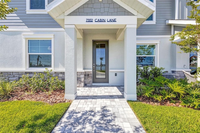 7352 Cabin Ln, Sarasota, FL 34240 - view of exterior entry with stone siding and stucco siding
