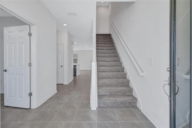 7352 Cabin Ln, Sarasota, FL 34240 - stairway featuring tile patterned floors