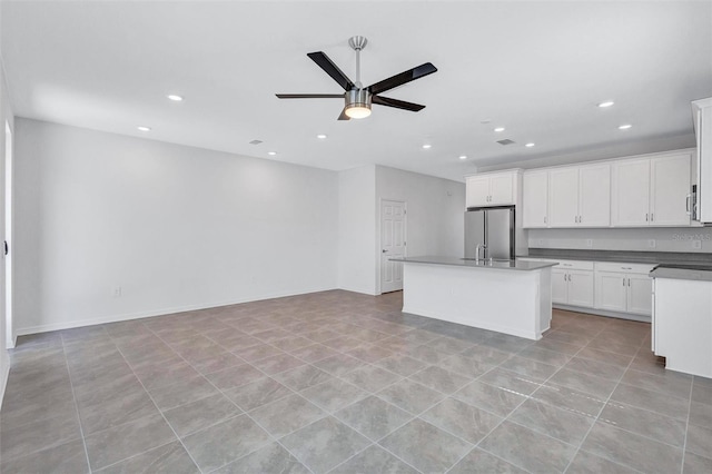 7352 Cabin Ln, Sarasota, FL 34240 - kitchen with freestanding refrigerator, a ceiling fan, open floor plan, dark countertops, and recessed lighting