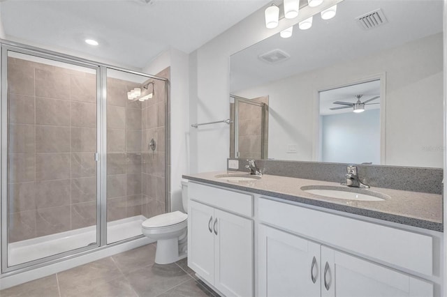 7352 Cabin Ln, Sarasota, FL 34240 - bathroom with tile patterned flooring, double vanity, a shower stall, and ceiling fan
