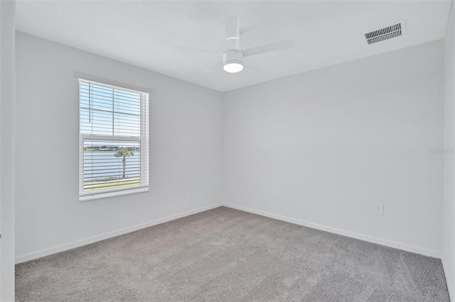 7352 Cabin Ln, Sarasota, FL 34240 - carpeted spare room featuring baseboards and a ceiling fan