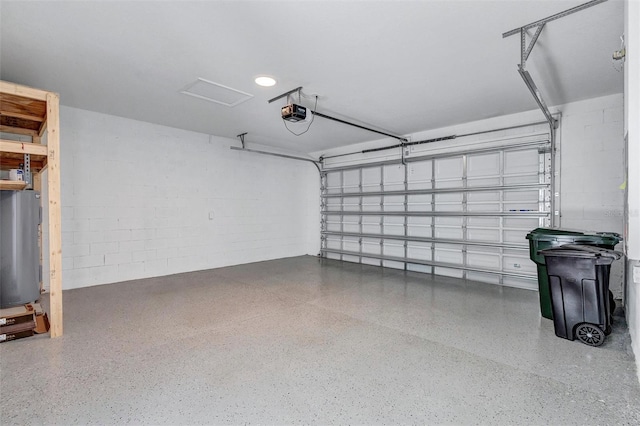 7352 Cabin Ln, Sarasota, FL 34240 - garage featuring a garage door opener, water heater, and concrete block wall