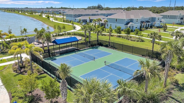 7352 Cabin Ln, Sarasota, FL 34240 - view of tennis court featuring a water view and a residential view