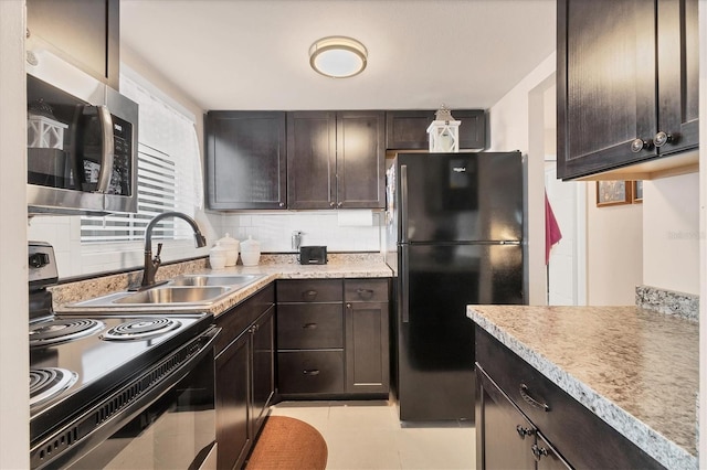 5891 Welcome Rd Unit I6, Bradenton, FL 34207 - kitchen featuring black appliances, dark brown cabinetry, light countertops, and decorative backsplash