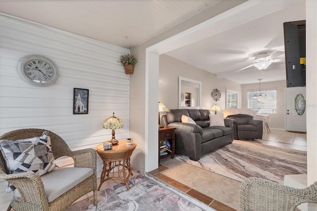 5891 Welcome Rd Unit I6, Bradenton, FL 34207 - tiled living room with a ceiling fan and wood walls
