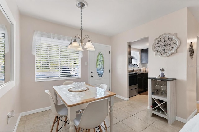 5891 Welcome Rd Unit I6, Bradenton, FL 34207 - dining space with a chandelier and light tile patterned floors