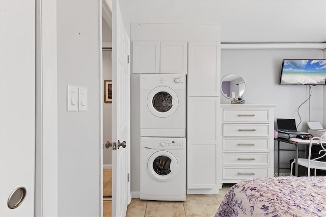 5891 Welcome Rd Unit I6, Bradenton, FL 34207 - laundry room with stacked washer / dryer and light tile patterned floors