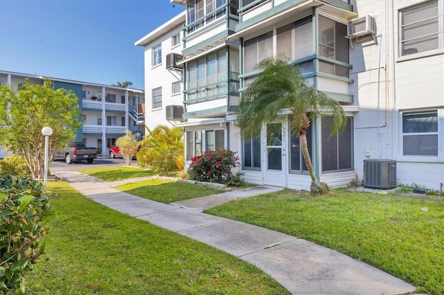 5891 Welcome Rd Unit I6, Bradenton, FL 34207 - view of building exterior with a wall mounted AC