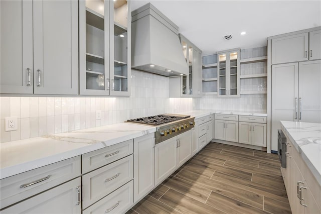 646 Calle Del Otono, Sarasota, FL 34242 - kitchen featuring extractor fan, stainless steel gas cooktop, open shelves, backsplash, and light stone countertops