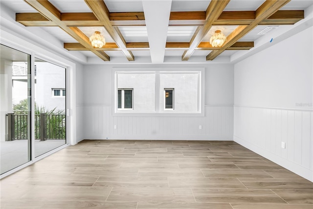 646 Calle Del Otono, Sarasota, FL 34242 - unfurnished room with a chandelier, coffered ceiling, beam ceiling, wainscoting, and light wood-style flooring