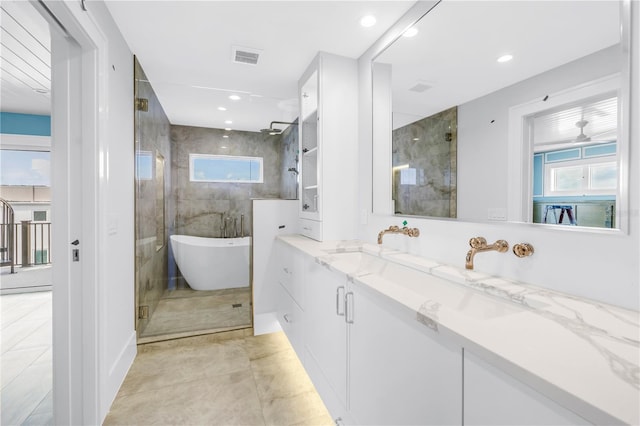 646 Calle Del Otono, Sarasota, FL 34242 - full bath featuring vanity, a soaking tub, healthy amount of natural light, a shower stall, and recessed lighting
