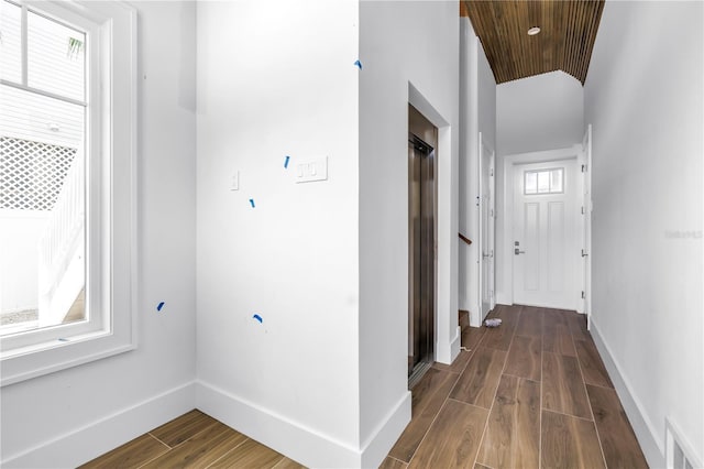 646 Calle Del Otono, Sarasota, FL 34242 - hall featuring dark wood finished floors and wooden ceiling